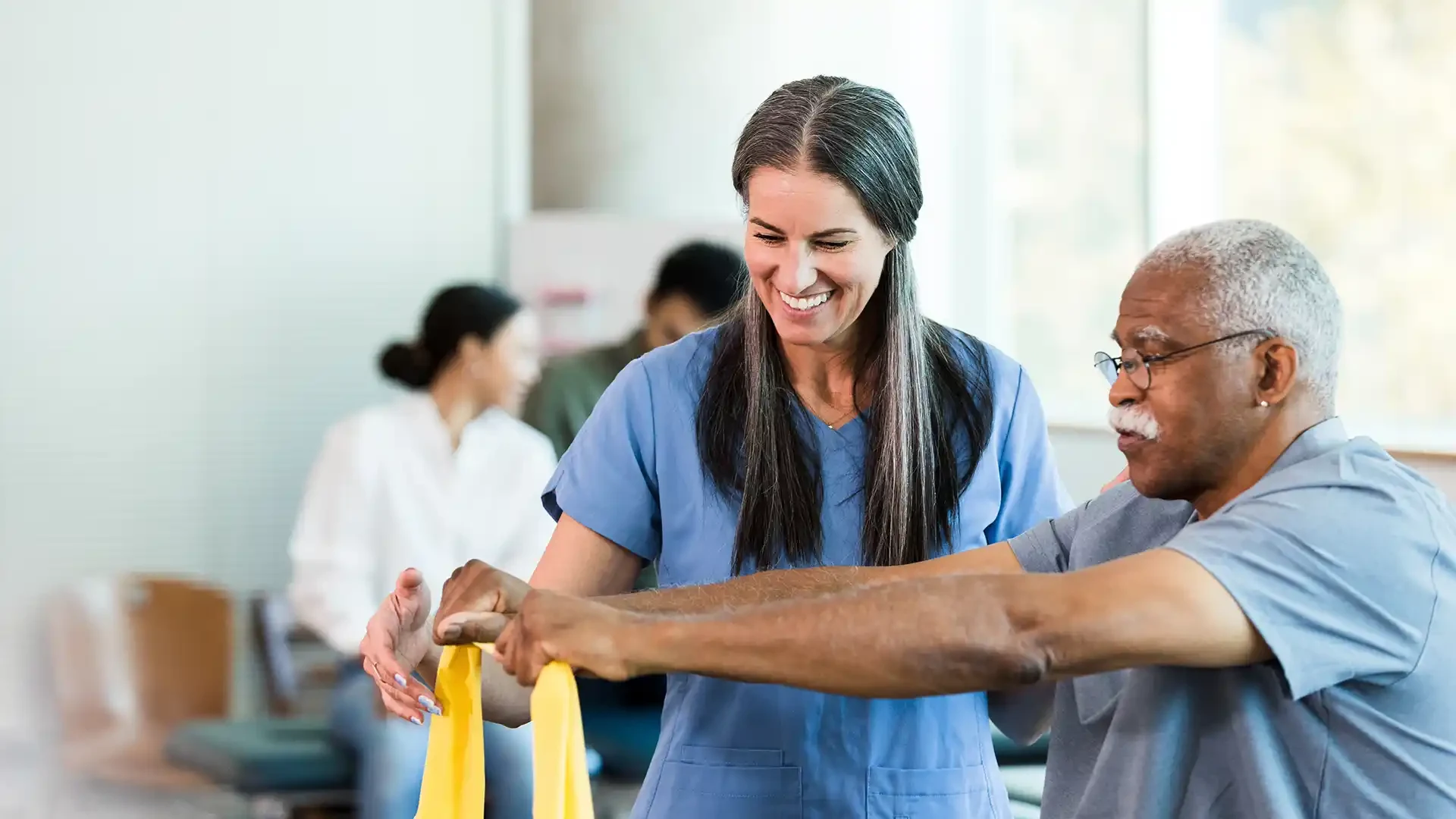 Occupational therapist working with an older adult